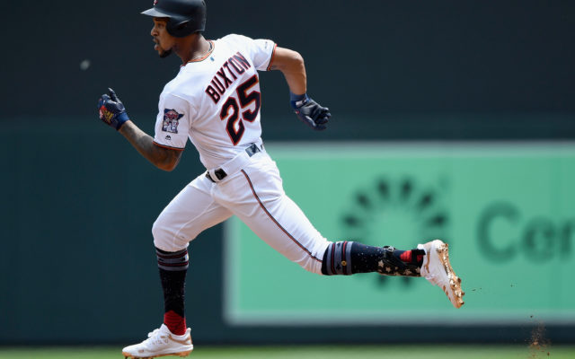 Buxton homer pushes Twins over Royals 8-4